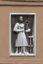 Relief of a male figure on a residential building, Venice, Veneto, Italy