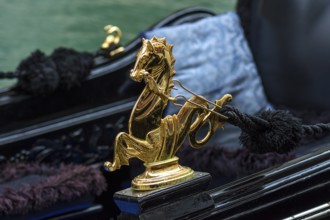 Mytological brass horse figure on a gondola, Venice, Veneto, Italy
