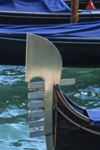 The metal tail of a gondola with six points symbolizing the six districts of Venice, Venice,