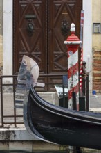 Mellschweif on a gondola, the six spikes symbolize the six districts of Venice, Veneto, Italy