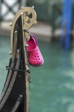 Children's shoe from the child of a gondolier on a gondola, Venice, Veneto, Italy