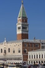 Spire of St. Mark's Campanile, in front the Doge's Palace, blue sky, Venice, Veneto, Italy