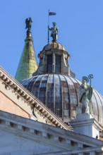 Bronze figures on the towers of the church of San Giorgio Maggiore, Venice, Veneto, Italy