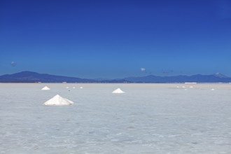 Bright salt landscape with small hills and foothills in the background, clear quiet atmosphere, The