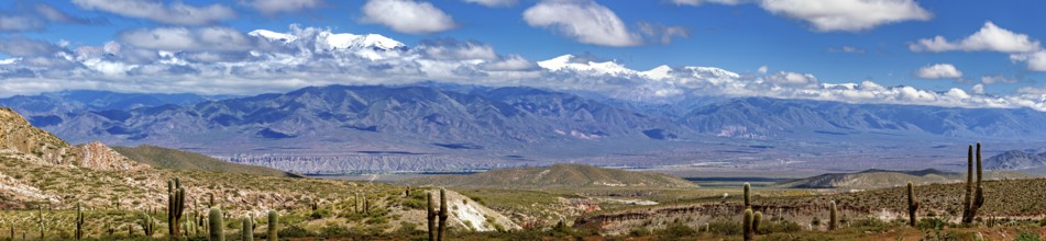 Panoramic picture of a wide mountain landscape with valley and clear sky, The landscape of the