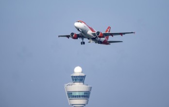 Easyjet Airbus A319 aircraft takes off from Kaagbaan runway, 06/24, at Amsterdam Schiphol Airport,