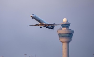 Lufthansa cityline aircraft takes off from Kaagbaan runway, 06/24, at Amsterdam Schiphol Airport,