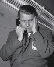 Dr. Wernher von Braun on the phone in the log cabin in front of the launch of Pioneer IV on March