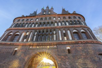 15th century Brick Gothic city gate Holstentor, Holstein Gate in the Hanseatic town Lübeck at