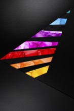 Colorful abstract design with geometric shapes in vivid hues on paper. Dynamic contrast of purple,