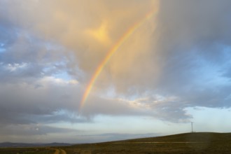 Gentle evening mood with a rainbow over open countryside and clouds at the salt lake, Tuz Gölü,