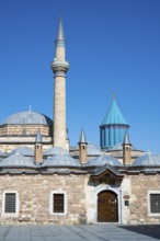 Mosque with minaret and turquoise dome under blue sky, Mevlana Museum, Mevlana, landmark, mausoleum