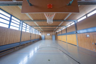 Large, bright gym with basketball hoop and floor markings, Schlehengäu Grund Schule Gechingen, Calw