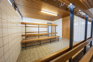 A quiet changing room with wooden paneling and tiled floors, Schlehengäu Grund Schule Gechingen,
