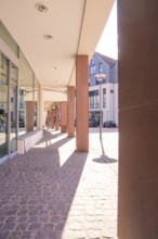 Modern urban environment with pillars and shade in bright sunshine, Calw, Calw district, Germany