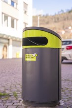 Modern trash can in an urban environment with buildings in the background, Calw, Calw district,