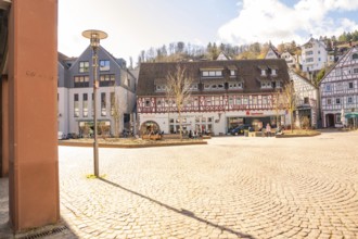Sunny town square with half-timbered houses and lively atmosphere, Calw, Calw district, Germany