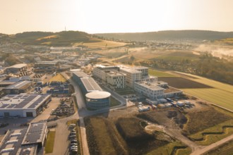 Aerial view of modern buildings in a vast rural area in the morning haze, new hospital at Calw
