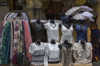Offers of lace embroidery in a shop window, Burano, Veneto, Italy