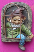 Garden gnome on a house wall, Burano, Veneto, Italy