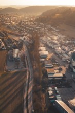 Industrial Landscape at Twilight with Roads and Houses nestled in Hilly Terrain, Aidlingen,