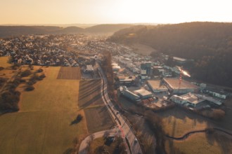 Aerial view of urban and industrial areas transitioning into countryside, Aidlingen, Böblingen