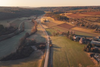 Fields and a road extending through a rural landscape under sunny skies, Aidlingen, Böblingen