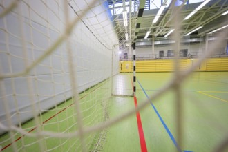 Network of a handball goal in a large sports hall from a side perspective, Handball, Calw, Germany