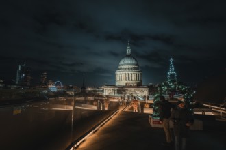View of London with illuminated St. Paul's Cathedral and festive decor at night, London, Great