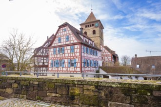 View of half-timbered houses and church tower under blue sky, Ötisheim, Enzkreis, Germany