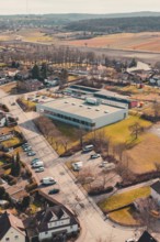 Aerial view of a village with buildings and trees surrounded by fields, Ötisheim, Enzkreis, Germany