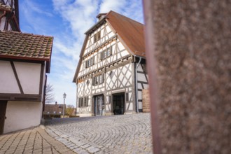 Timbered house and cobblestone street in a quiet historic village, Ötisheim, Enzkreis, Germany
