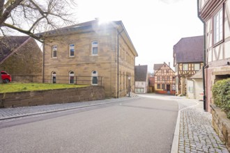 Street scene in the old town with various historic buildings and weak sun, Ötisheim, Enzkreis,