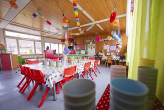 Creative kindergarten room with colorful table decoration and cheerful details, inviting
