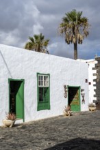 Typical white houses with colored doors and windows, Teguise, Lanzarote, Canary Islands, Spain