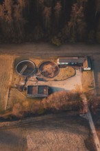 Sewage treatment plant next to a building in an autumnal landscape seen from the air, Gechingen,