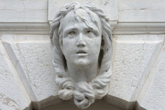 Sculpture of a woman's head above a gate, Venice, Ventien, Italy