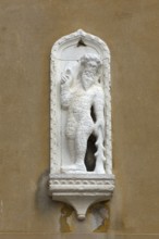 Relief of a figure on a house façade, Venice, Veneto, Italy