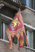 Venetian flag on a balcony, Venice, Veneto, Italy
