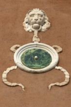 Relief of a lion's head on a house wall, Venice, Veneto, Italy