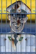 1950s traffic police officer metal sign behind a wire fence, Bavaria, Germany