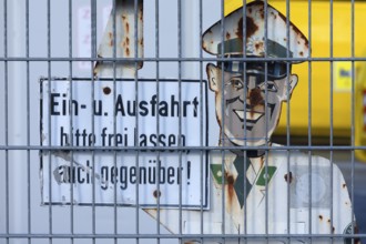 1950s traffic police officer metal sign behind a wire fence, Bavaria, Germany