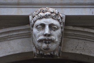 Sculpture of a head above a gate, Venice, Veneto, Italy