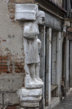 Marble statue of a merchant family from the 13th and 14th century, Campo dei Mori in the Cannaregio