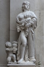 Female sculpture with a column in her arms, Venice, Veneto, Italy