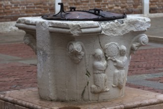 Old fountain with relief design, Venice, Veneto, Italy