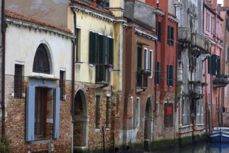 Different house facades on the canal, Venice, Veneto, Italy