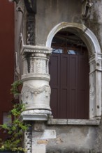 Decorative columns at the entrance of a palazzo, Venice, Veneto, Italy