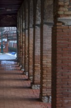 Arcades with brick columns in the old town, Venice, Veneto, Italy