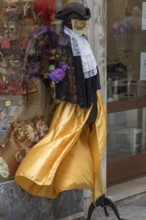 Venetian carnival costume in front of a shop, Venice, Veneto, Italy